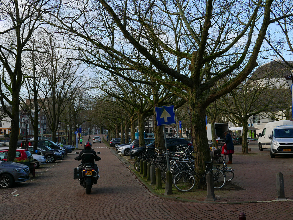 Amsterdam old canal Prinsengracht with trees in winter - at the right the square Amstelveeld with the historic